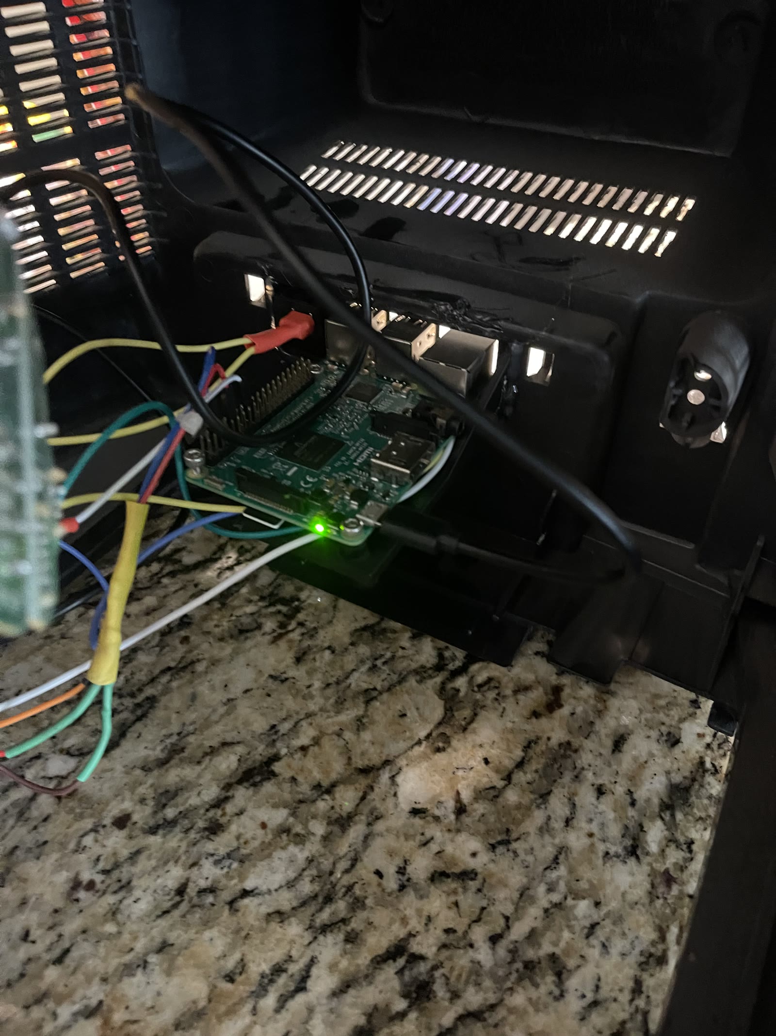Raspberry Pi mounted and wired inside the TV chassis